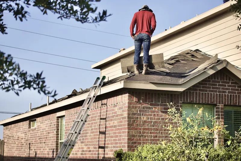 Professional roofer working on a residential roof in North La Verne